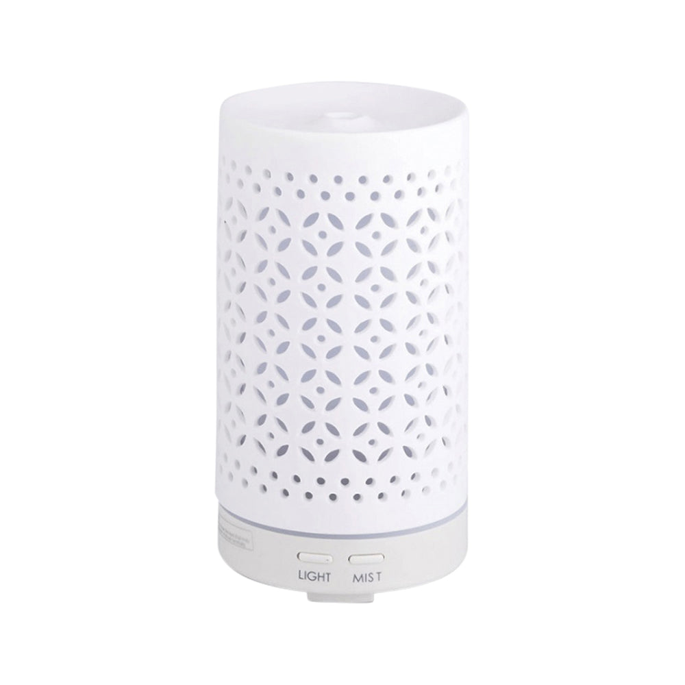 White diffuser with decorative pattern on a white background