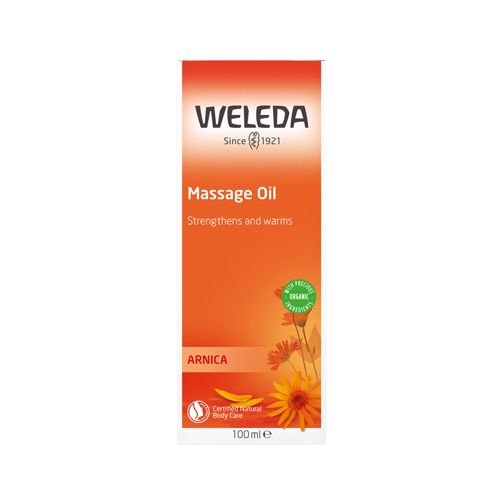 Weleda Arnica massage oil packaging on a white background