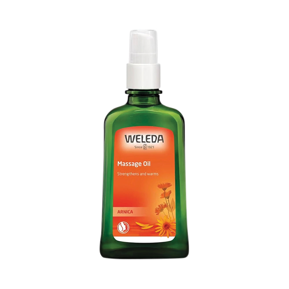 Weleda Arnica Massage Oil bottle on a white background