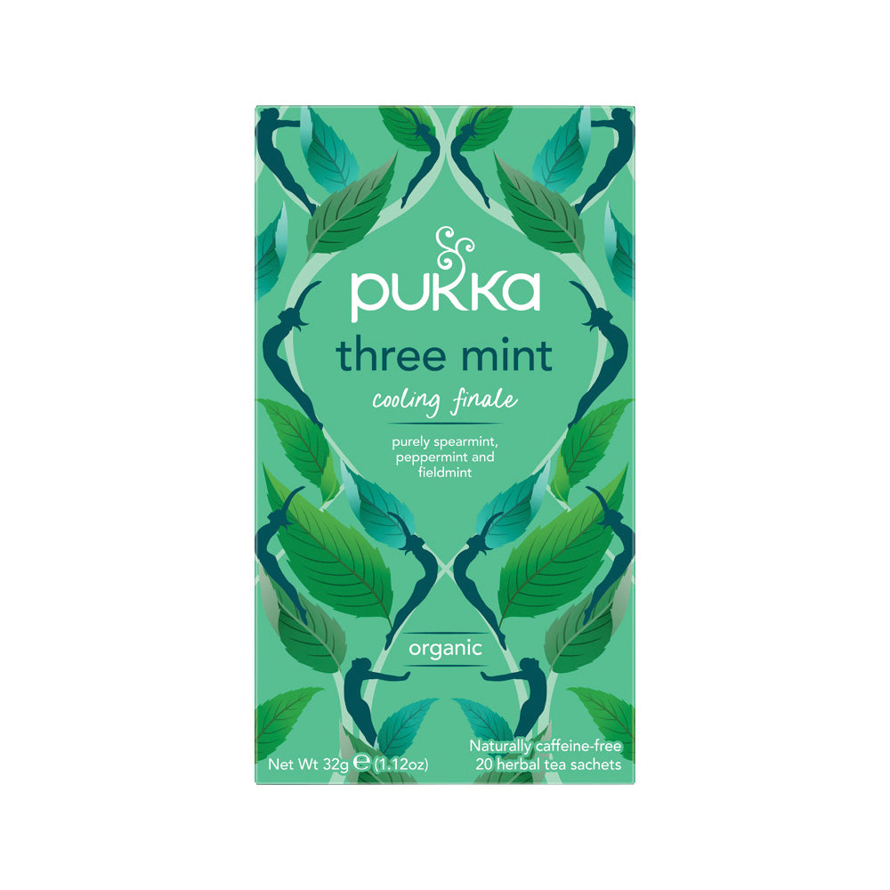 Pukka three mint tea packaging with green leaves on a white background