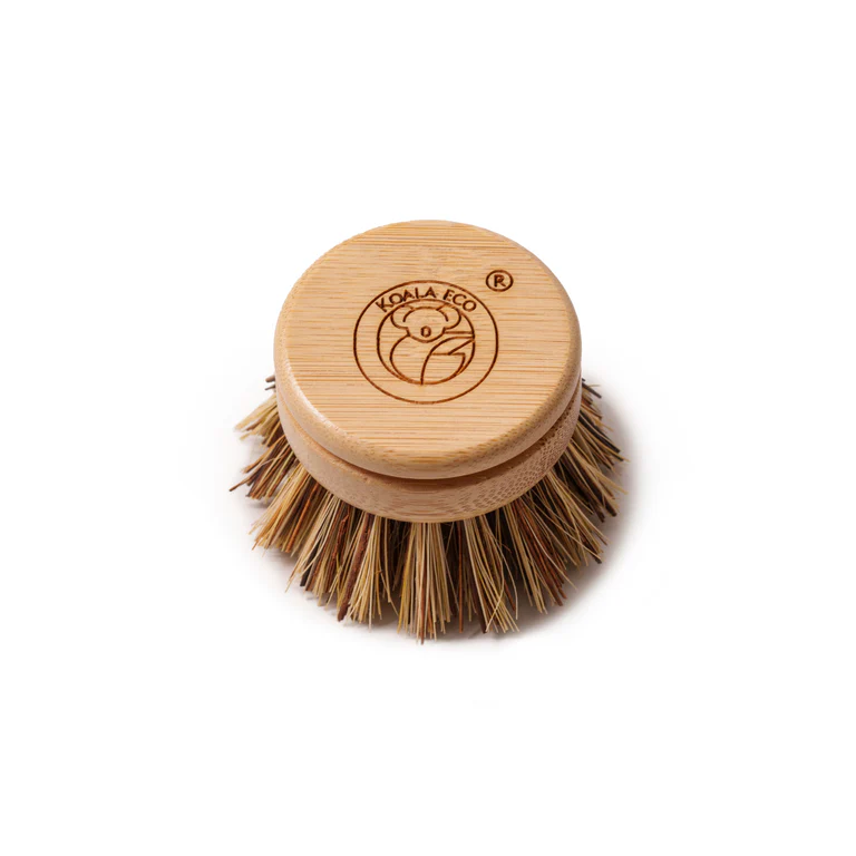 Bamboo dish brush with bristle head on a white background